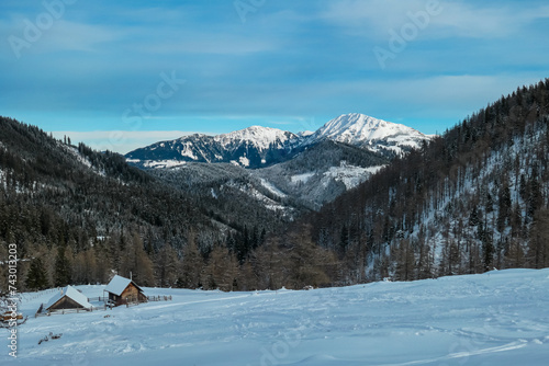 Panoramic view of snow capped mountain peak Hohe Veitsch on the way to mount Hochanger, Muerzsteg Alps, Styria, Austria. Ski touring winter wonderland in remote Austrian Alps. Idyllic snowy landscape