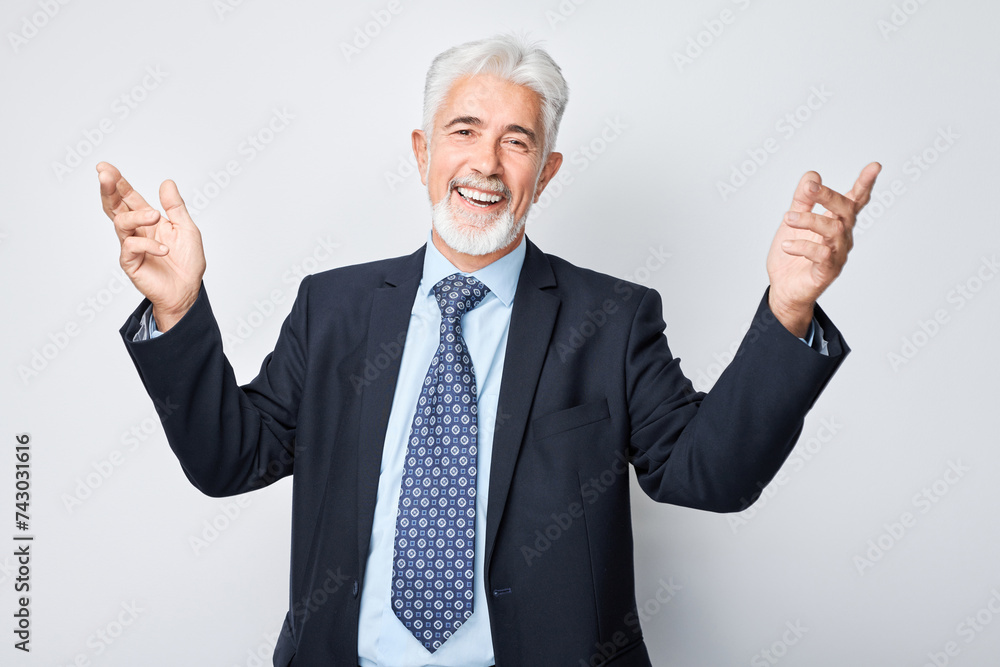 Portrait gray-haired man happy face smiling joyfully with raised palms and shocked open mouth isolated on white studio background. Portrait gray-haired man happy face smiling joyfully with raised palms and shocked open mouth isolated on white studio background.
