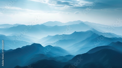 Landscape with rays of light through layers of mountains