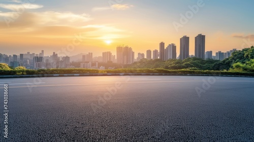 Empty asphalt road and modern city skyline with buildings view at sunset #743038668