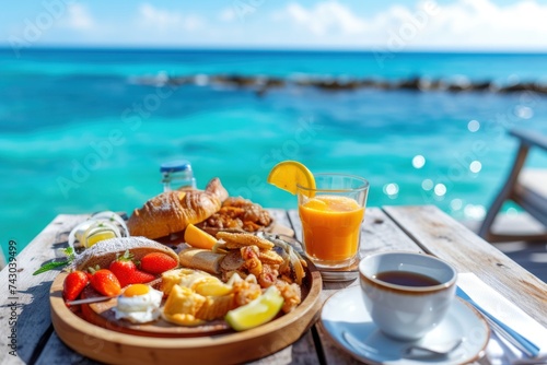 Luxury breakfast food on wooden table, with beautiful sea background.