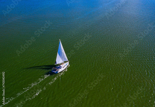 Aerial view of Indian River Lagoon with sailboats and clear blue waters, Sebastian, Florida, United States. photo