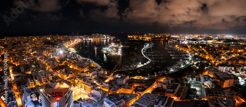 Aerial view of dense urban cityscape at night, Gzira, Malta. photo