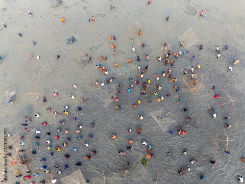 Aerial view of traditional fishing festival on a winter lake, Rajshahi Division, Bangladesh. photo