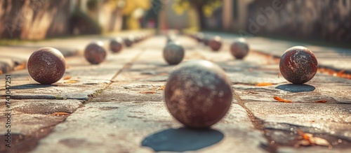 Bocce is a ball sport belonging to the boules sport family closely related to bowls and p tanque with a common ancestry from ancient games played in the Roman Empire. with copy space image photo