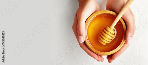 Female hands holding a bowl...
