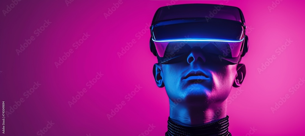Creative young man wearing hi tech glasses and headphones against vibrant background with copy space Creative young man wearing hi tech glasses and headphones against vibrant background with copy space
