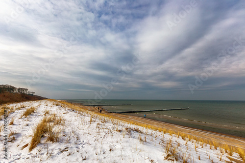 snow covered dunes at the beach of the Baltic Sea in Germany 