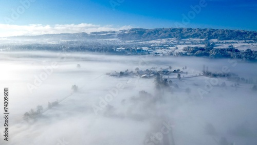 Village in morning fog