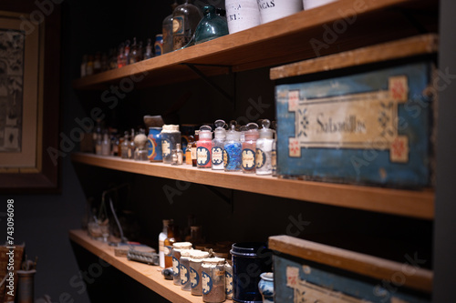 Detail of some old pharmacist shelves that contain glass jars with components, elements and medicines to prepare master recipes. Dates from 1910 in the municipal museum of Llivia