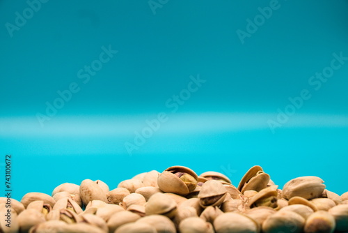 Pistachios isolated on blue background
