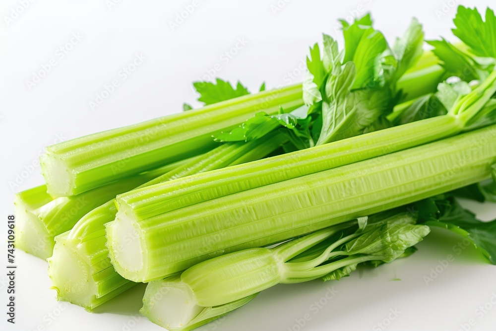 Green fresh celery sticks on white background Green fresh celery sticks on white background
