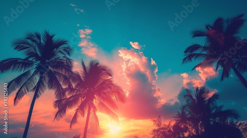 View of silhouette palm trees against blue sky during sunset © Shami