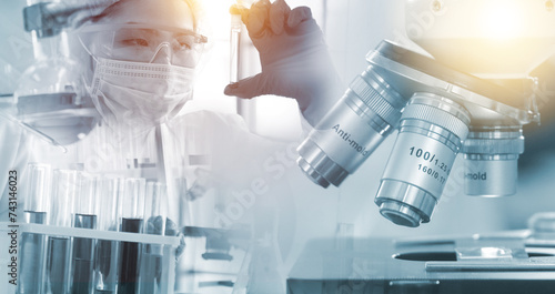 Double exposure microscope and Young woman scientific using equipment in the laboratory for research.Biotechnology,development,chemical,vaccine,Photo concept experimentation and research.