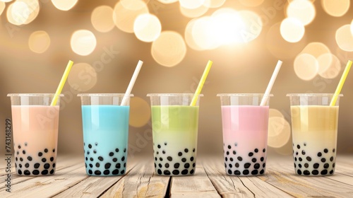 Assorted tapioca bubble teas in coffee shop with blurred background, ideal for cozy text placement. © Andrei