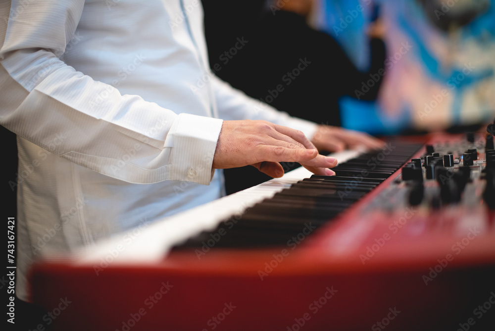 Close up of a professional keyboarder playing