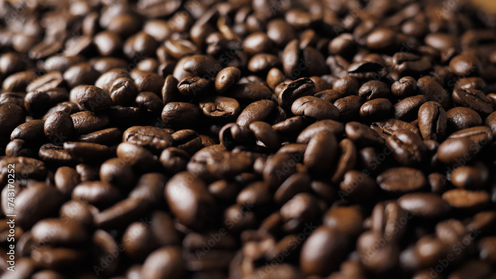 Aromatic coffee beans close-up. Grain inspection. A large amount of coffee Aromatic coffee beans close-up. Grain inspection. A large amount of coffee