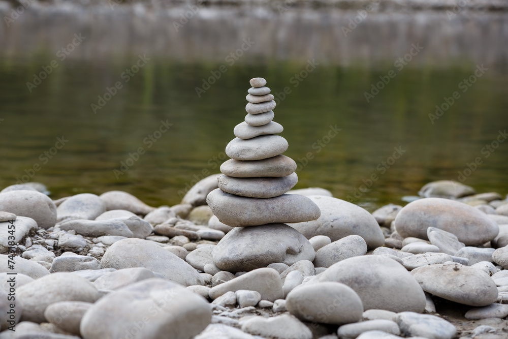 Amazing round stone near a flowing river, Stones are perfectly balanced on one another and forming, These are river stones, or also buddha stones