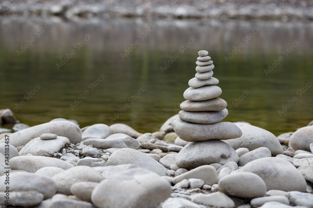Amazing round stone near a flowing river, Stones are perfectly balanced on one another and forming, These are river stones, or also buddha stones