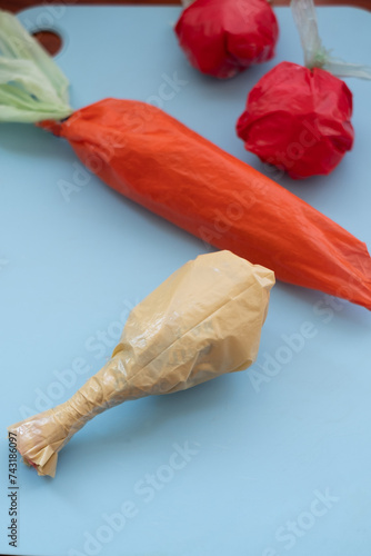 Plastic bags shaped as food on a blue background photo