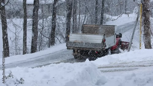 Wallpaper Mural Municipal Truck salts and plows residential road during heavy snowstorm Torontodigital.ca