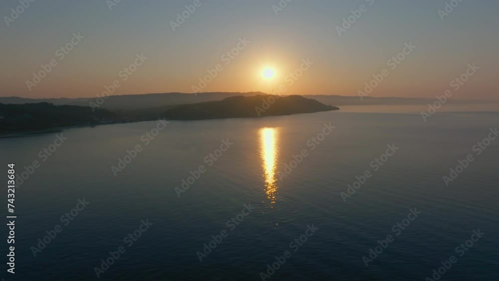 Drone advancing over serene sea waters at sunrise Drone advancing over serene sea waters at sunrise