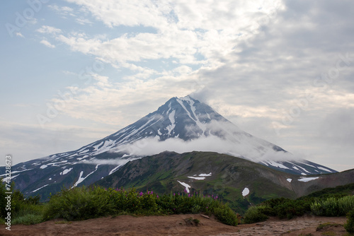 View of the volcano. Travel and tourism on the Kamchatka Peninsula. Beautiful nature of Siberia and the Russian Far East. Vilyuchinsky Volcano (Vilyuchinskaya Sopka), Kamchatka Territory, Russia.