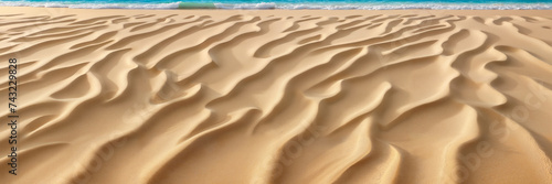 A peaceful scene of a sandy beach stretching along the ocean with gentle waves caressing the shore
