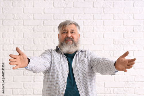 Mature man opening arms for...
