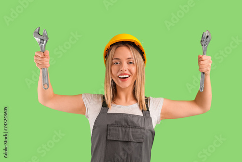 Female worker in hardhat an...