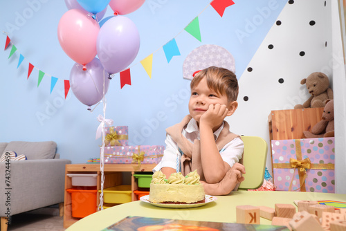 Little boy with cake celebr...