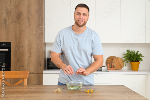 Young man preparing steam i...