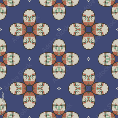Seamless geometrical ethnic pattern with Native American masks of Eskimo or Inuit Indians. Ethnic Indigenous design. On blue background.