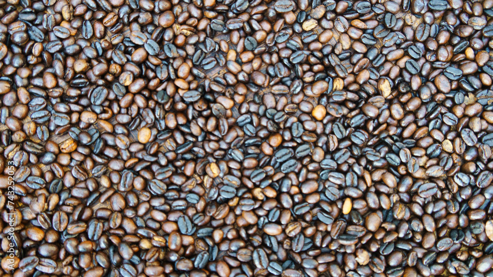 Roasted coffee beans in different shades of brown and black - African kilimanjaro tanzania coffee Roasted coffee beans in different shades of brown and black - African kilimanjaro tanzania coffee