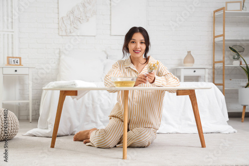 Young Asian woman preparing...