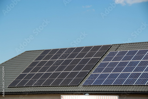 House roof with photovoltaic modules. photo