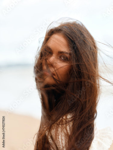 Carefree Young Woman Enjoying Summer Vacation on Beach, Smiling