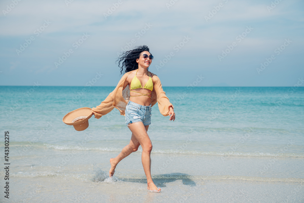 Happy beauty woman walking on the beach having fun in a sunny day, Beach summer holiday sea people concept.
