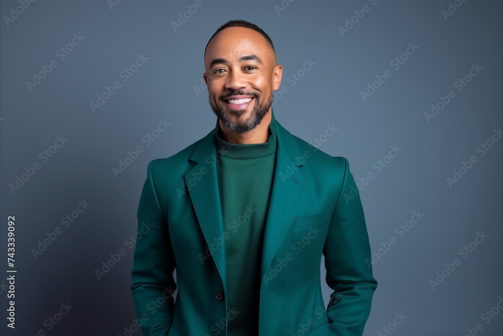 Portrait of a handsome african american man in a green suit.