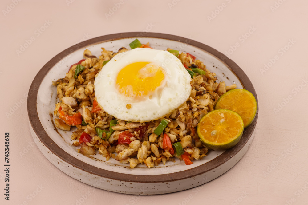 Bangus Sisig is Filipino Traditional Food Made with Flaked Milk Fish, Citrus Juice and Peppers. 