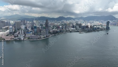 Hong Kong Convention and Exhibition Centre in Wan Chai Central Admiralty Causeway Bay CBD facing Victoria Harbour Kowloon Tsim Sha Tsui ,4K drone shot of property commercial area photo