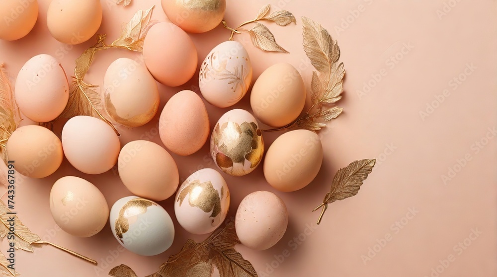 Easter eggs painted in gold and peach fuzz colors on a peach color background, top view, Easter concept in trendy colors 2024