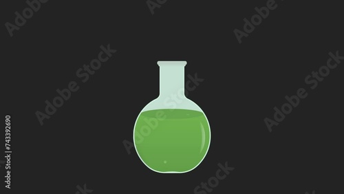 green liquid bubbling in potion bottle. Poison and dangerous substance photo