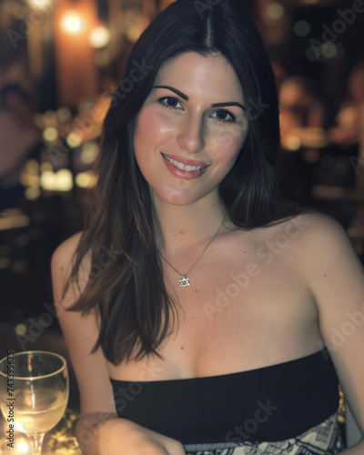 A photograph of a 30-year-old attractive brunette on date night sitting down at a upscale bar. 