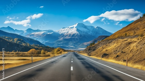 A breathtaking scene featuring a beautiful mountain range with a straight road highway. 