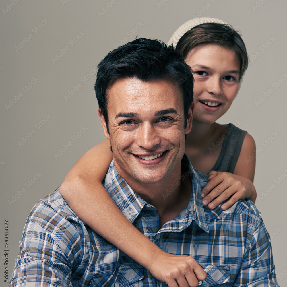 Happy father, portrait and child with hug for love, care or support in fashion on a white studio background. Face of dad, son or kid with smile in casual clothing or trust for parenting or bonding Happy father, portrait and child with hug for love, care or support in fashion on a white studio background. Face of dad, son or kid with smile in casual clothing or trust for parenting or bonding