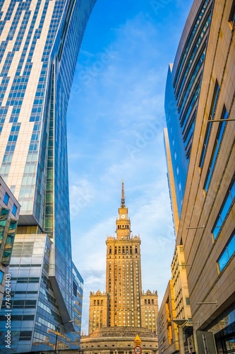 Palace of Culture and Science with modern buildings in Warsaw, Poland photo