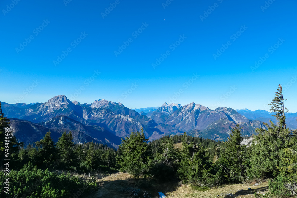 Panoramic view of majestic mountain peaks of Gesäuse seen from Hochblaser in Eisenerz Alps, Ennstal Alps, Styria, Austria. Idyllic hiking trail in remote Austrian Alps in summer. Wanderlust in nature