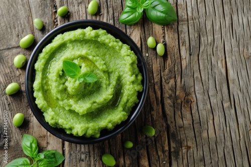 A delicate spicy bouquet: avocado in green wassabi sauce, presented on a wooden table photo