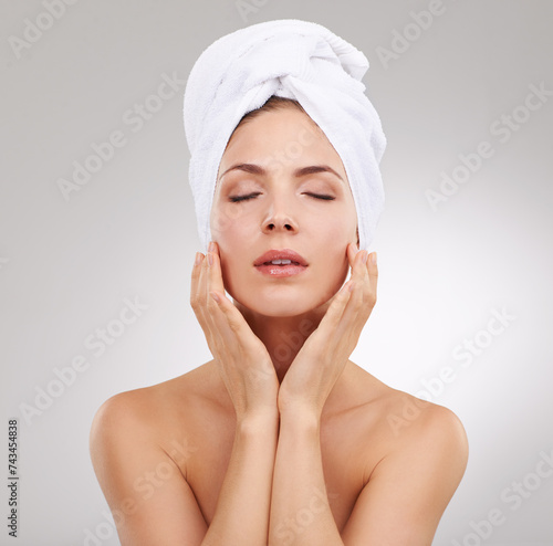 Beauty, cosmetics and face of woman with towel, natural glow and getting ready in studio. Dermatology, healthy skin and girl on white background with luxury facial, morning routine and skincare.
